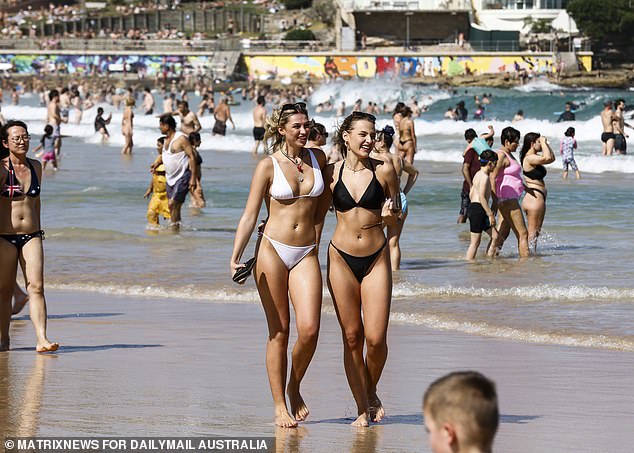 Next, a cold front will pass through southern Australia and drag warm air towards the east coast (pictured, visitors on a Sydney beach)