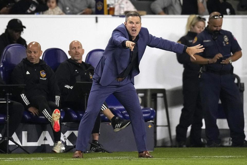 Galaxy head coach Greg Vanney gestures and yells at his team from the sideline during a 2024 regular season game.