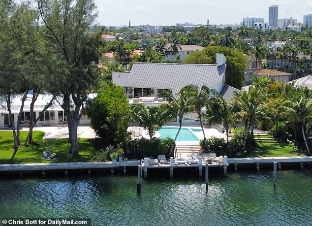 The abode is also complete with a generous boat dock where outdoor sofas and lounge chairs can be seen, and offers stunning views of the nearby creek.