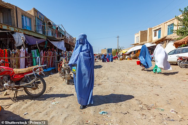 Afghan women dressed in burqa at the Andkhoy market, Faryab province, northern Afghanistan