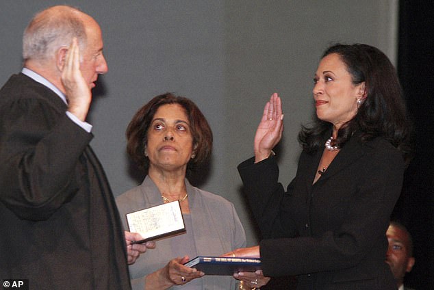 New San Francisco District Attorney Kamala Harris (right), with her mother, Dr. Shyamala Gopalan, holding a copy of the Bill of Rights, receives the oath of office from California Supreme Court Chief Justice Ronald M. George .