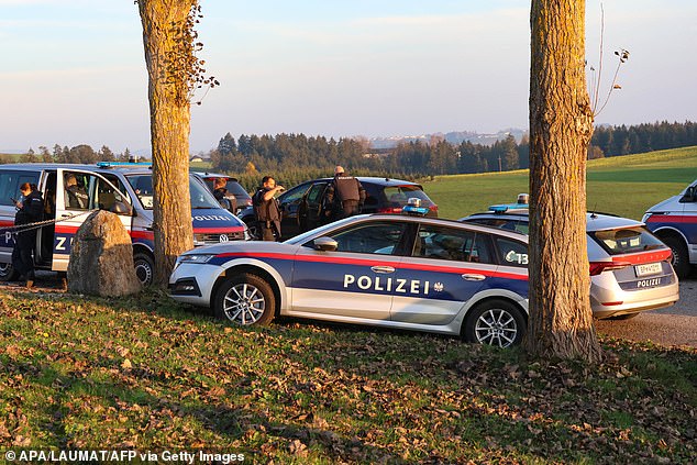 Police officers patrol near Rohrbach, Upper Austria, on October 28, 2024, during the chase for a gunman suspected of killing a local mayor and another person.