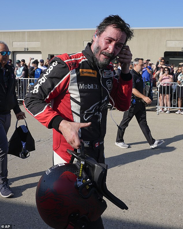 Reeves walks in the garage area after a GR Cup Series auto race at the Indianapolis Motor Speedway on Oct. 5 in Indianapolis.