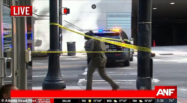 A SWAT officer is seen at the Four Seasons during the Tuesday afternoon shooting at the hotel.