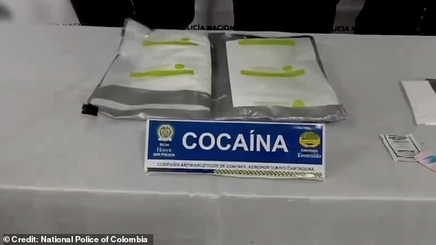 The illegal contents of his luggage, found in a false bottom, were displayed before him by a sign that said 'COCAINE' in capital letters.