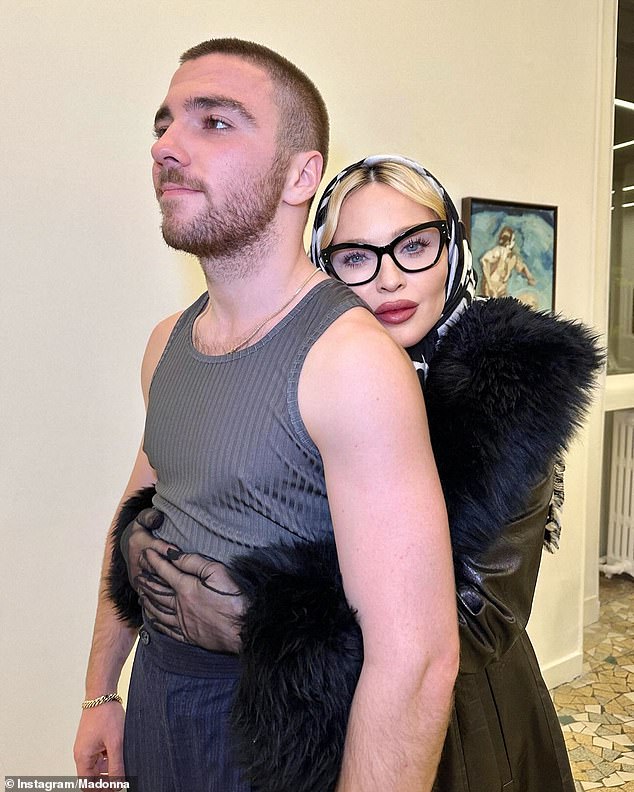 Madonna, 66, was in Paris this week to visit her son's art exhibition and was photographed hugging Rocco, 24, whose father is film director Guy Ritchie.