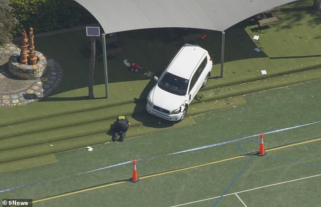 Toyota SUV seen with front bumper damaged after crashing into school fence