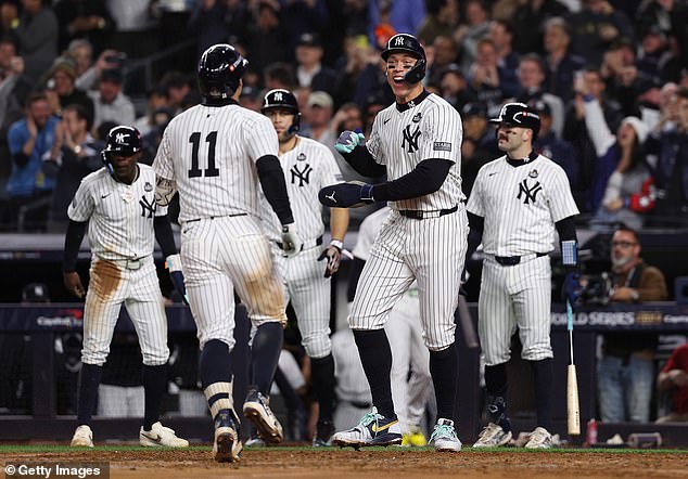 Aaron Judge celebrates with Volpe after his dramatic grand slam turns Game 4 around