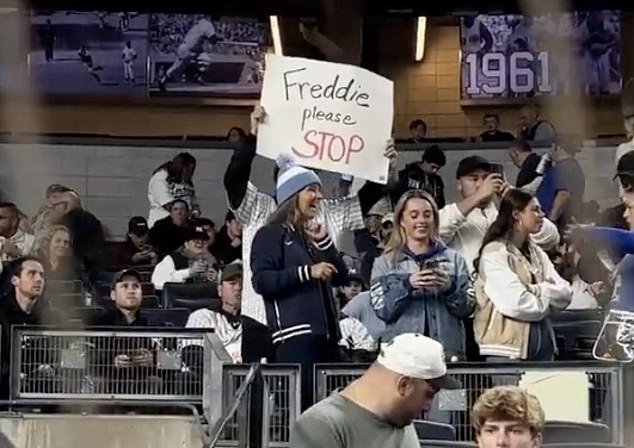 A Yankees supporter begs Dodgers star Freddie Freeman not to inflict any more pain on him.