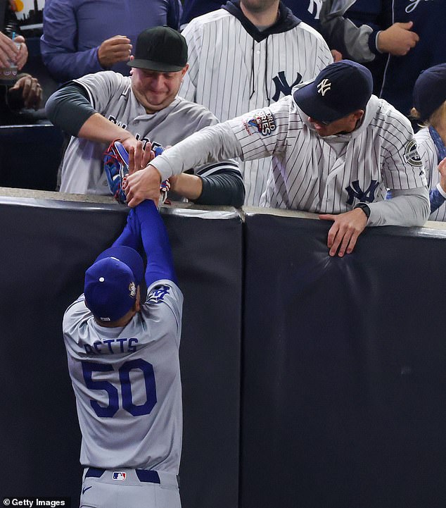 A Yankees fan tried to snatch the ball from Mookie Betts in dramatic scenes