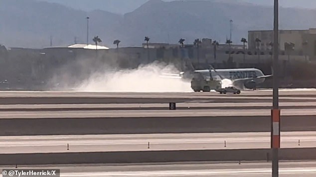 A Frontier spokeswoman explained that the flight was in the process of landing at Harry Reid International Airport when 'pilots detected smoke and declared an emergency.'