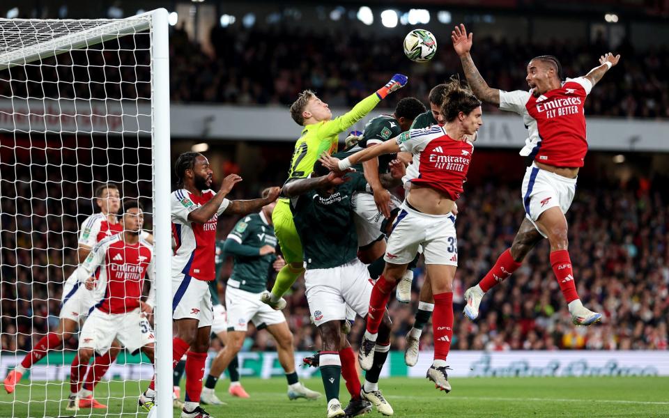 Jack Porter hits the ball during the English League Cup third round football match between Arsenal and Bolton Wanderers at the Emirates Stadium in London on September 25, 2024.