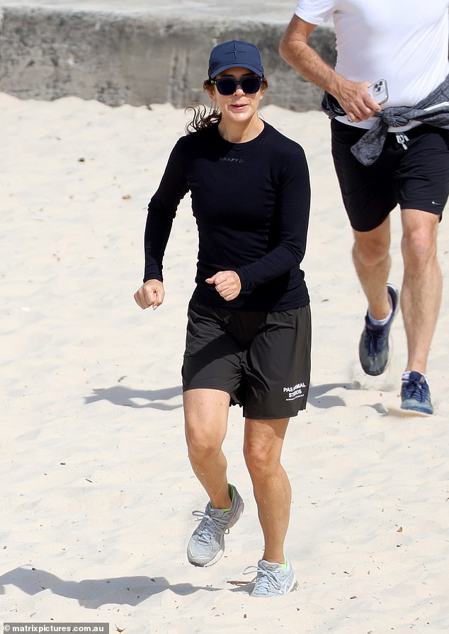 At one point, she was seen running through the sand with a friend while pulling her brown hair into a ponytail.