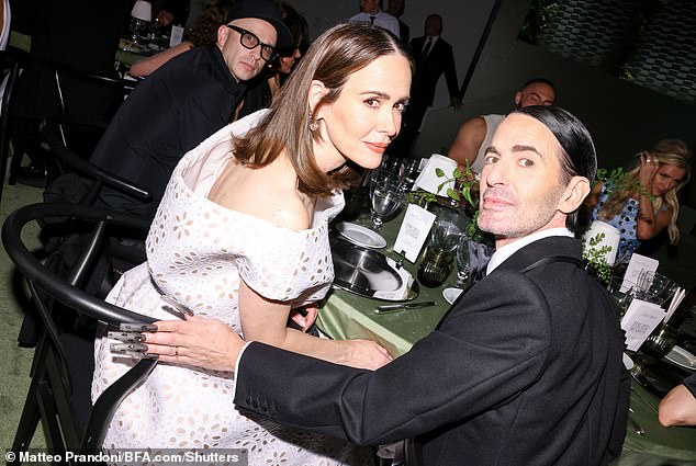 While at the event, she was seen posing at her table next to designer Marc Jacobs as they watched the ceremony closely.