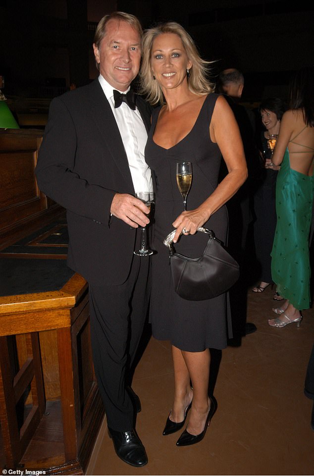 Gaynor was married to John's manager, Glenn Wheatley, from 1982 until his death in February 2022, and is one of the singer's dearest friends. Pictured together in 2003