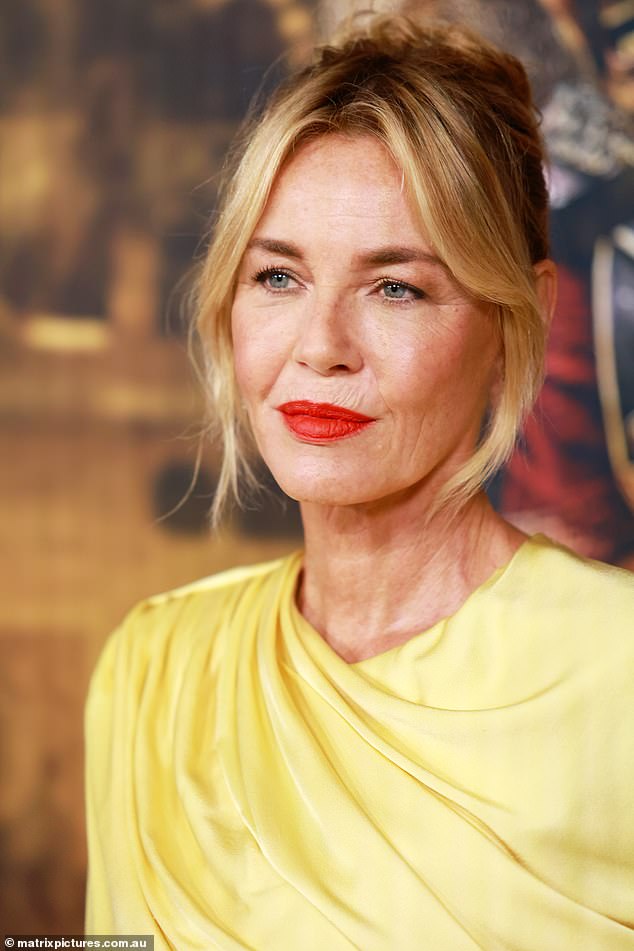 The Danish actress looks spectacular in a yellow Stella McCartney dress valued at $4,440.