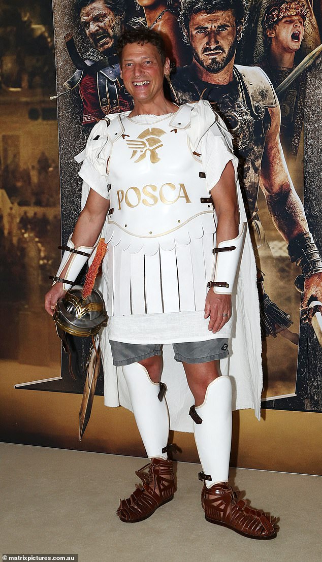 Merrick Watts, 50, (pictured) stayed true to the theme and arrived at the premiere in a white Gladiator costume.