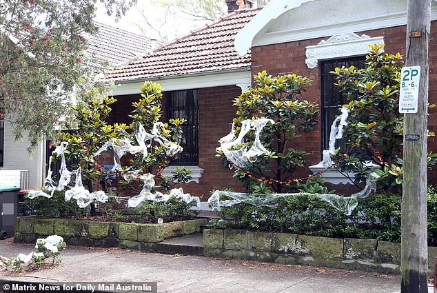 Homeowners hang cobwebs and spiders, add tombstones to their gardens, and even place skeletons in their windows to commemorate the occasion.