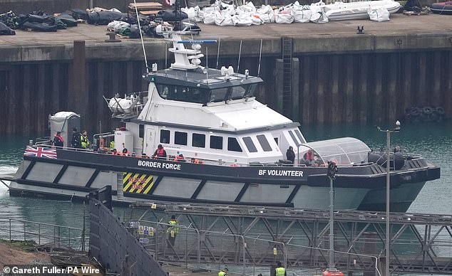 A group of people believed to be migrants are taken to Dover, Kent, aboard a Border Force vessel following an incident with a small boat in the English Channel today.