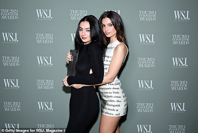 Emily was later seen joining Charli XCX on the red carpet as they stopped to take some memorable photos together.