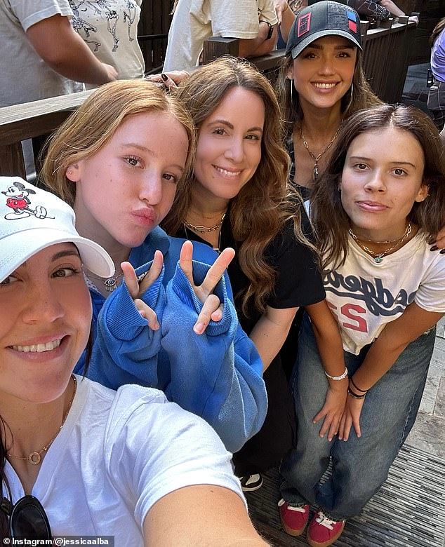 The ladies all met at Disneyworld, sporting red suede sneakers and baggy jeans and cargo pants.