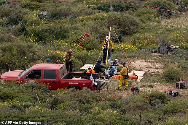 Authorities descended into a deep well to recover the bodies of the Robinsons and Mr. Rhoades.