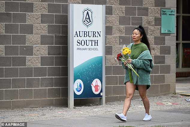 Woman seen leaving flowers at Auburn South Elementary School