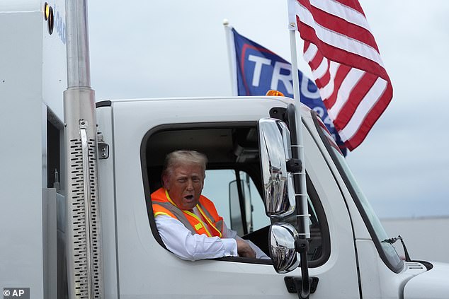 'What do you think of my garbage truck? This truck is in honor of Kamala and Joe Biden,' he told reporters in Green Bay.