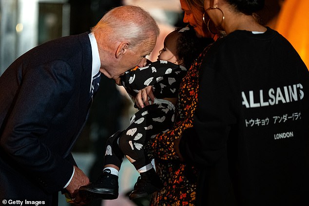 President Biden cuddled the baby of his aide Ashley Williams (right). The baby was in the arms of his former employee and current deputy director of personnel, Annie Tomasini.