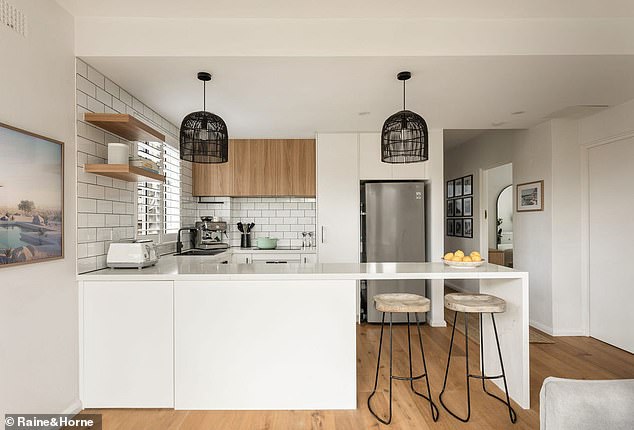 The modern kitchen is equipped with a Bosch induction oven and dishwasher.