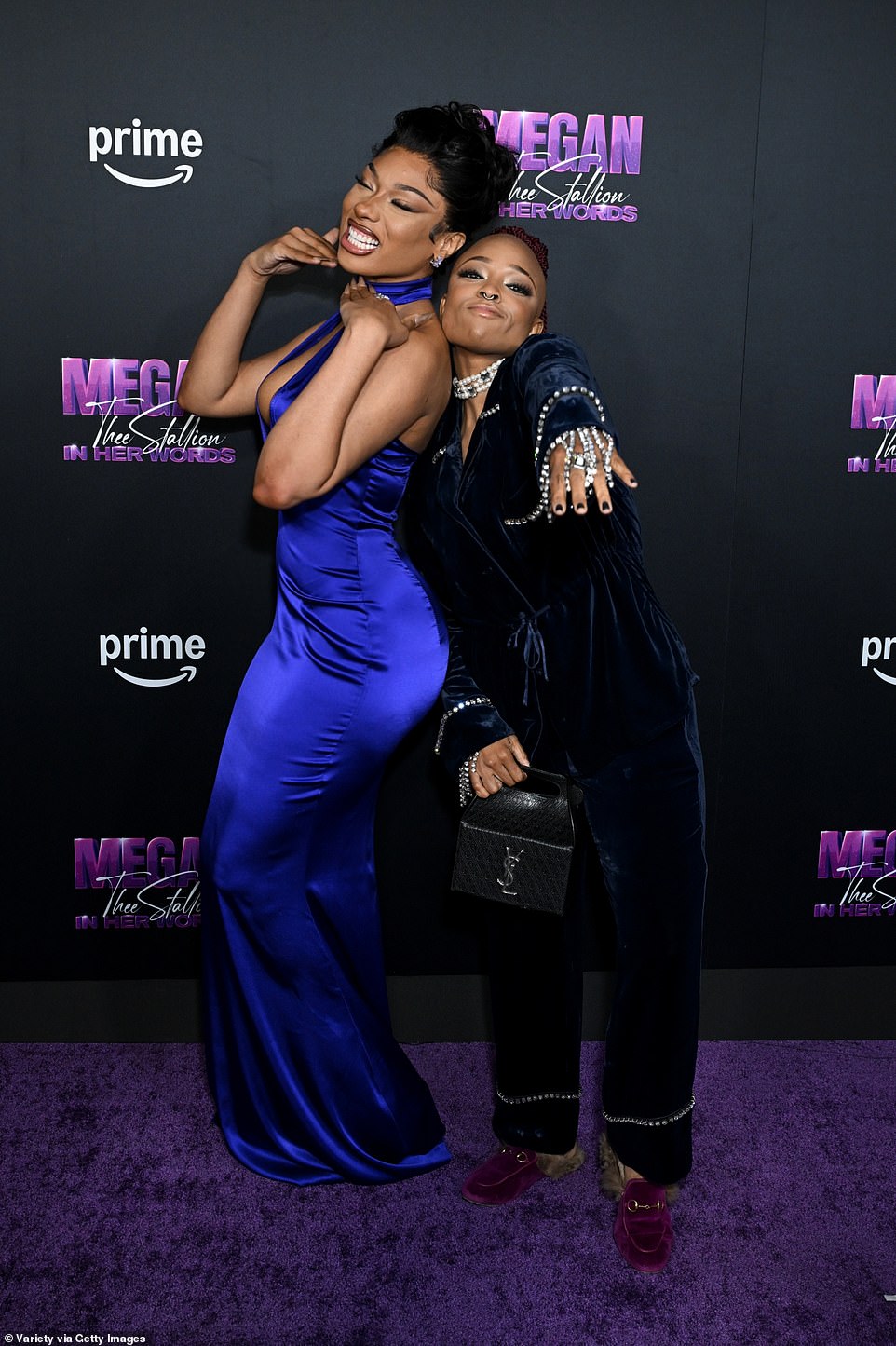 On the red carpet, he took a moment to pose with Nneka Onuorah, the documentary's director, who dazzled in an elegant pantsuit adorned with a stunning array of diamond jewelry.