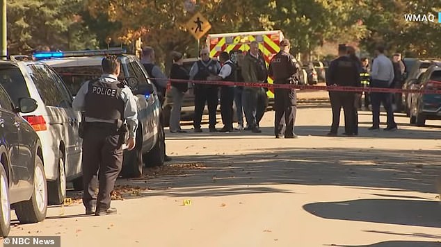 Officers seen at the scene after the shooting, where Abdallahi was hit several times.