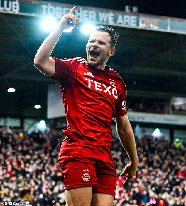 Aberdeen defender Nicky Devlin celebrates after scoring the first goal at Pittodrie