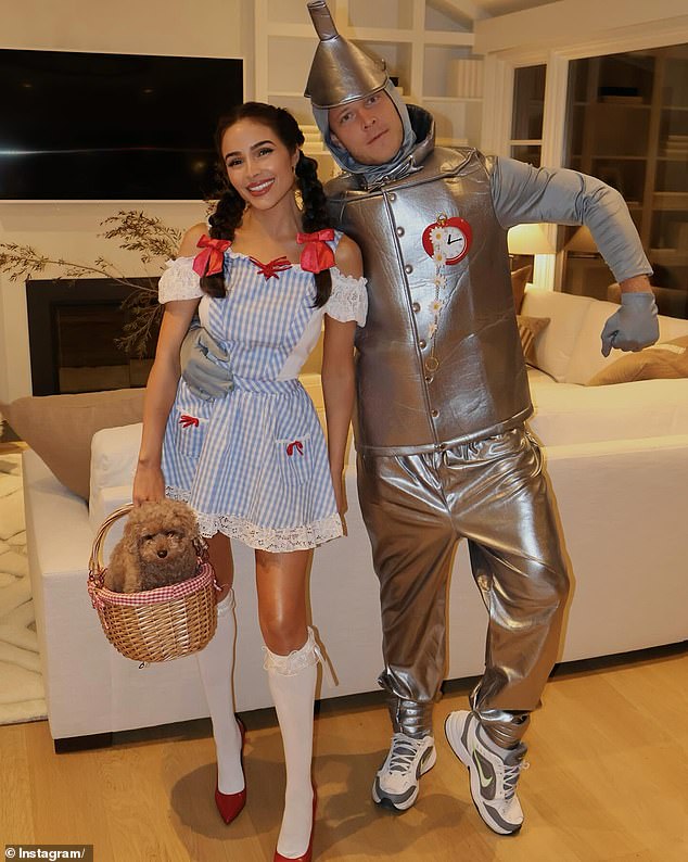 For the occasion, the model, 32, and her NFL star husband, Christian McCaffret, dressed up as Dorothy and Hickory, a farmhand also known as the Tin Man, from The Wizard of Oz.