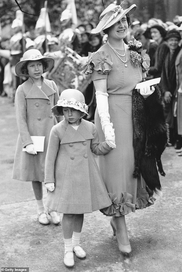 March 1935: Elizabeth, Duchess of York with her daughters, Princesses Elizabeth and Margaret Rose, arrive at Glamis Castle, Angus, to present the colors to the 4th and 5th Regiment of the Black Watch.