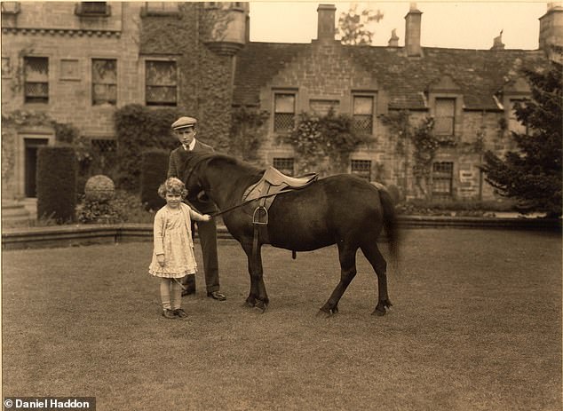 The young Princess Elizabeth at Glamis Castle playing with a pony