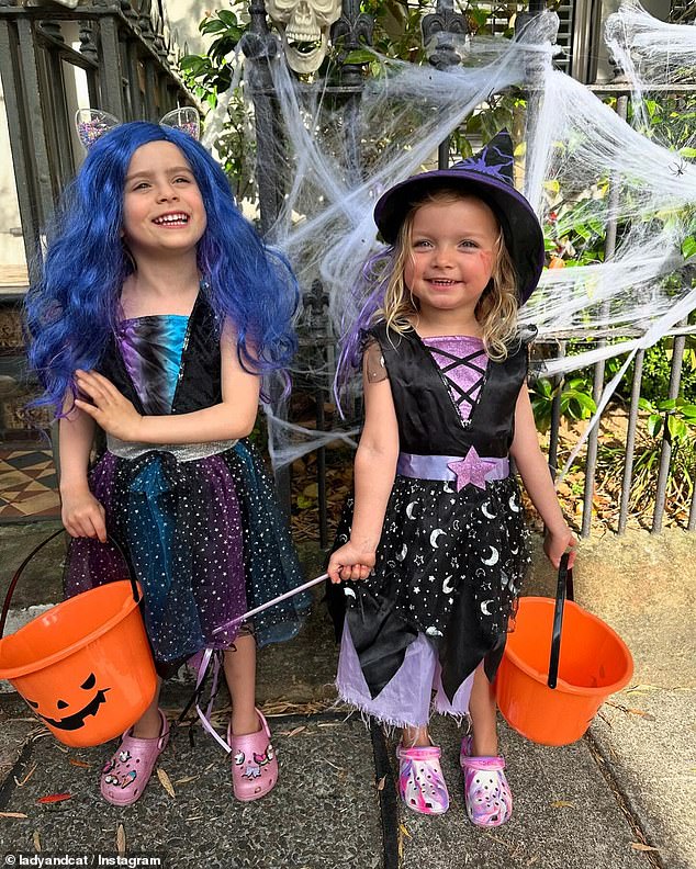 Their daughters Marlie-Mae and Lola looked adorable as they went trick-or-treating dressed as witches. in the photo