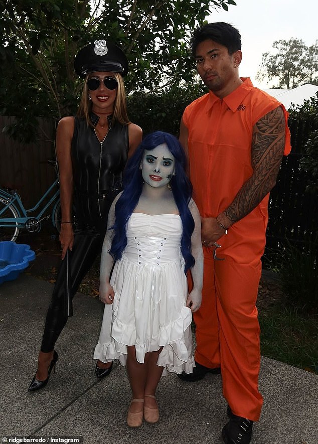 Jade zipped up her daring costume for a more modest display as she posed for a family photo with her daughter Victoria, dressed as the Corpse Bride.