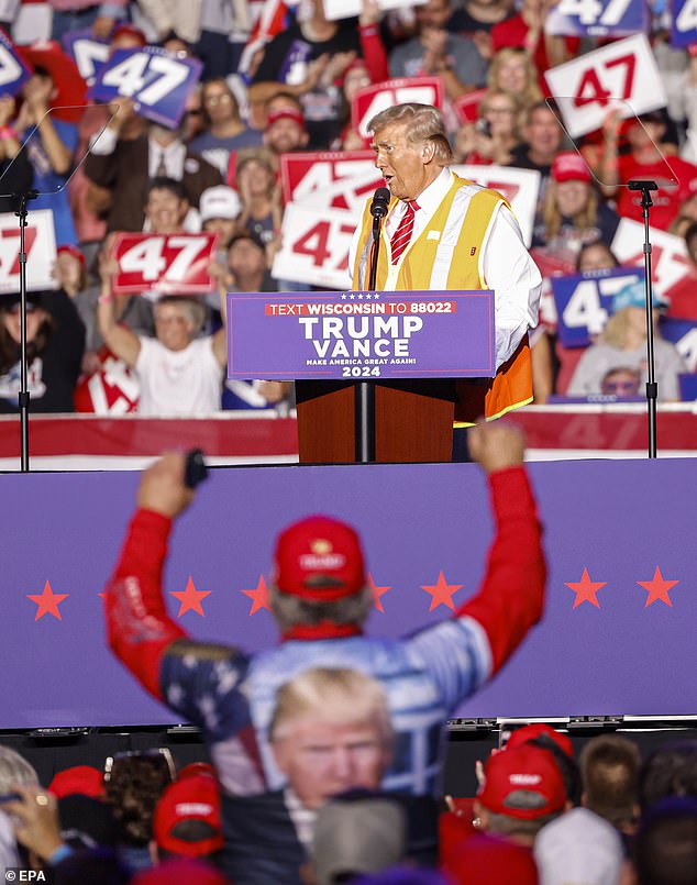 Trump kept his vest on for his rally in Green Bay and talked about how difficult it was to get into the truck