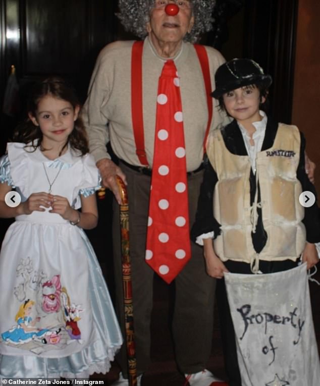 In one sweet snap, Catherine's children looked adorable in costumes as they posed with their grandfather.