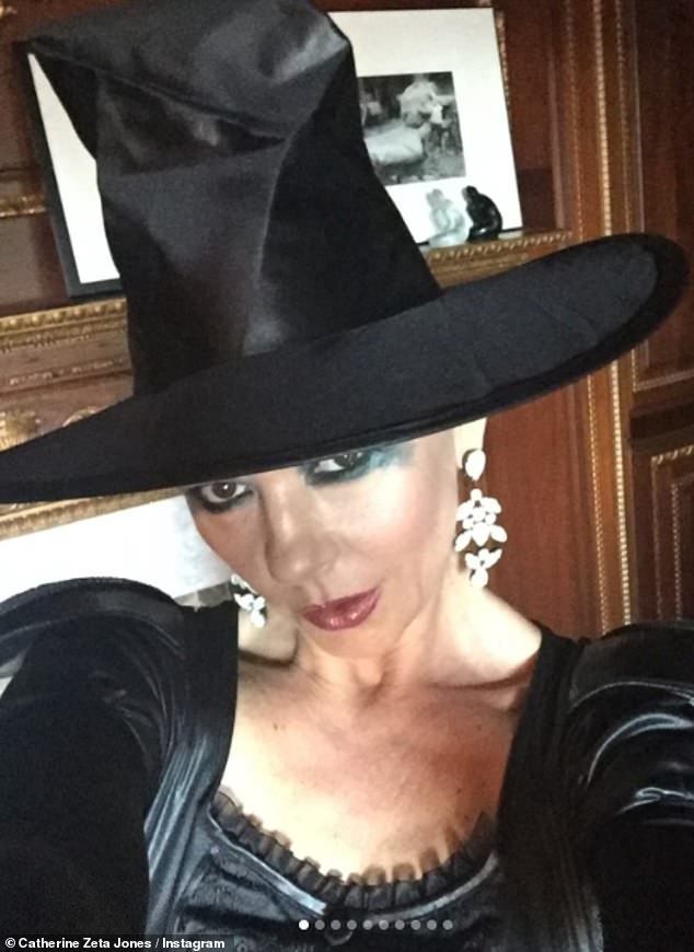 While in another snap, Catherine dressed as a classic witch and wore an extravagant hat and dramatic green eye makeup.