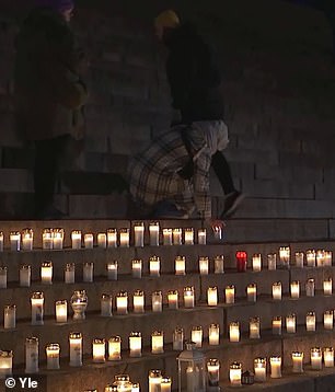 In the photo: Candles lit at a monument to Janne in Helsinki