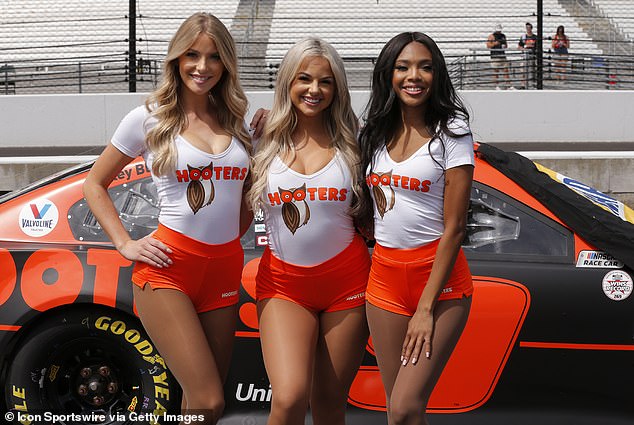 The restaurant chain is famous for its aging waitresses, seen here representing the company at a Nascar event in 2021.