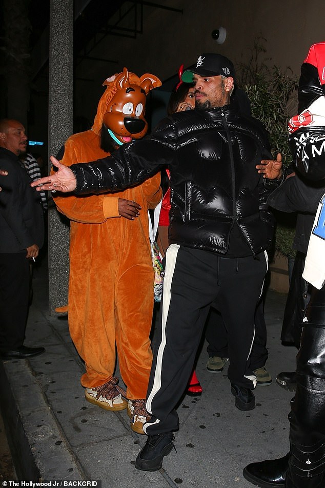 The singer opted not to wear a costume to the Halloween party as he headed there with a group of friends.