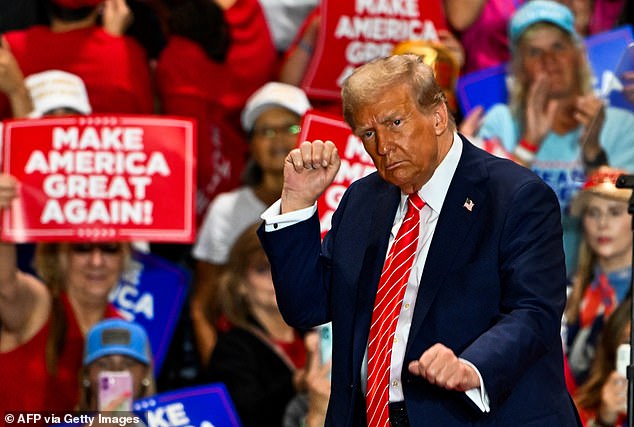 Trump dances as he leaves a campaign rally in Rocky Mount, North Carolina, on October 30, 2024.