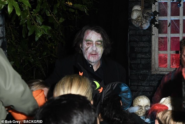 The ITV star donned white face paint and dyed green eyebrows as he greeted children alongside performers dressed as Little Red Riding Hood, a wolf and a clown.