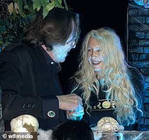 The couple was all smiles as they enjoyed the Halloween festivities.