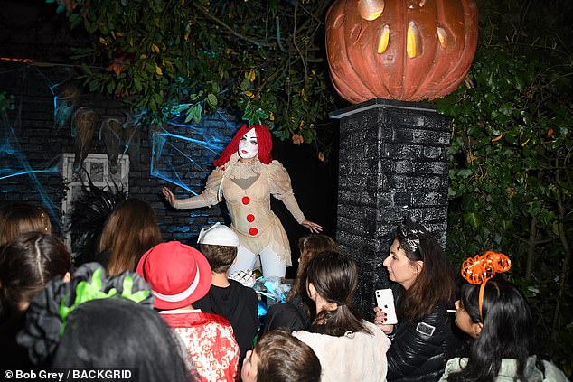 A clown stood at the entrance.