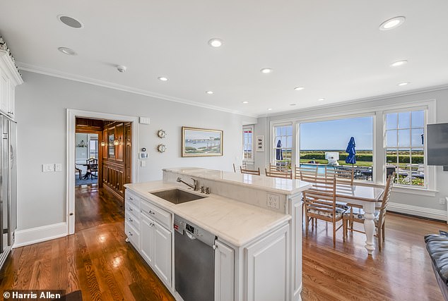 The spacious kitchen is one of 26 rooms in the enormous estate that boasts stunning water views.