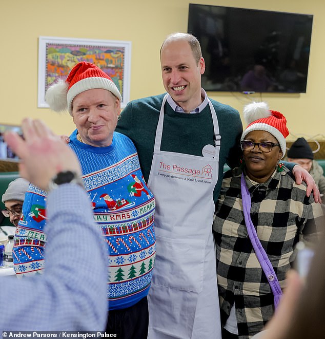 The Prince of Wales posed for photos with guests at The Passage, including one wearing a very festive jumper.